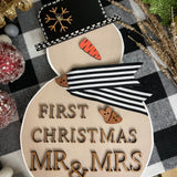 This image shows the large tan snowman that says First Christmas Mr. & Mrs.