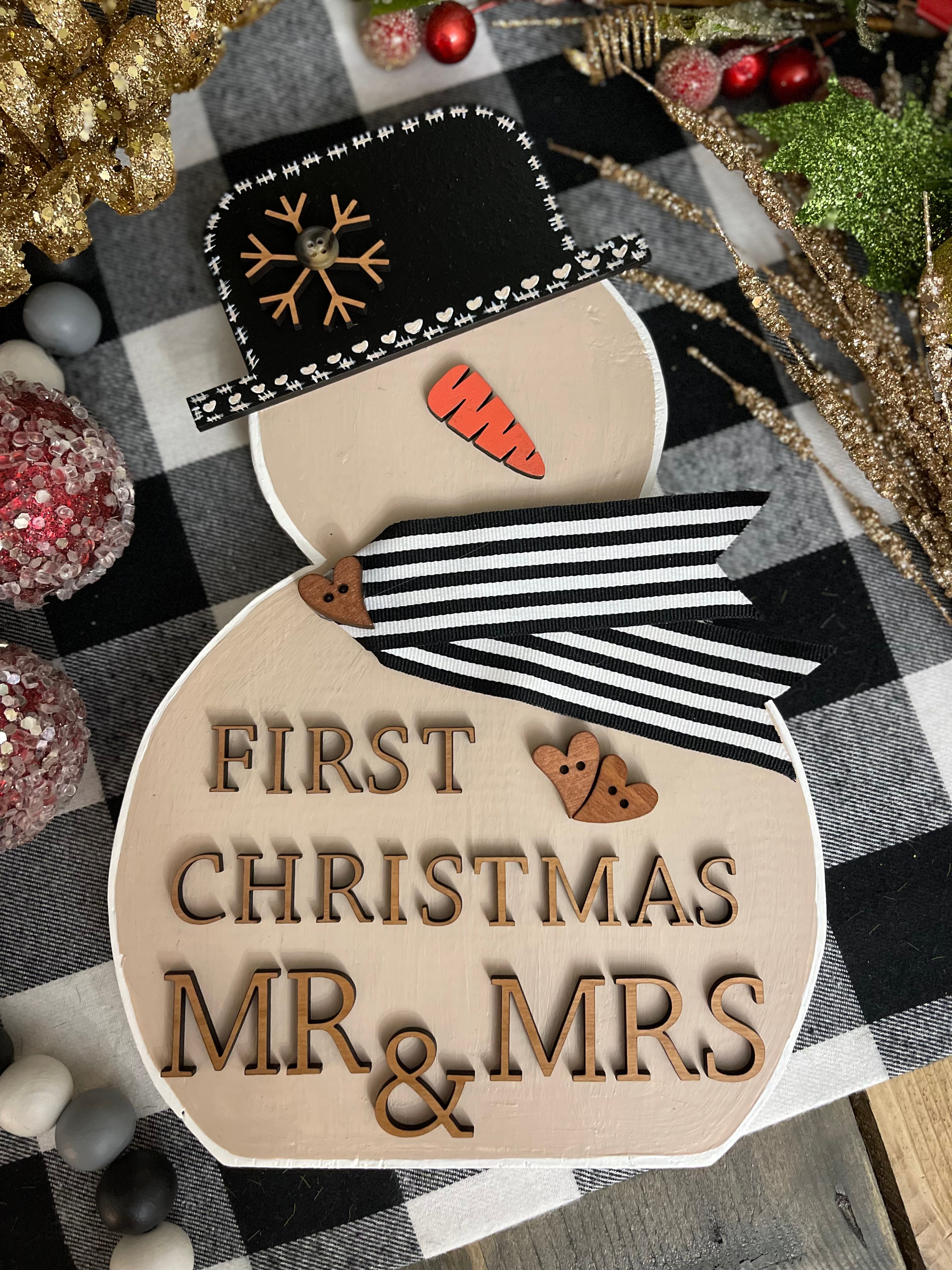 This image shows the large tan snowman that says First Christmas Mr. & Mrs.