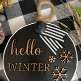This image shows the Hello Winter large black ornament.