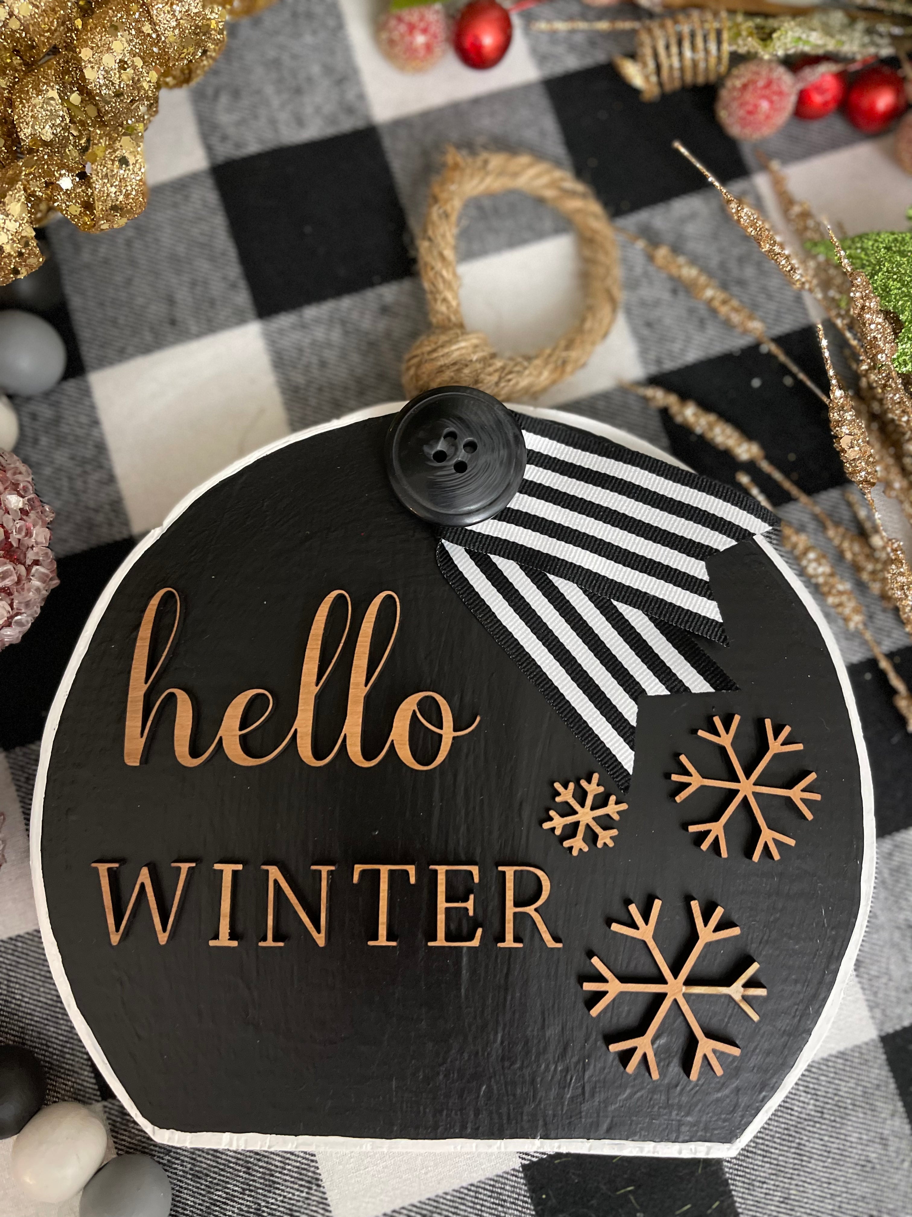 This image shows the Hello Winter large black ornament.