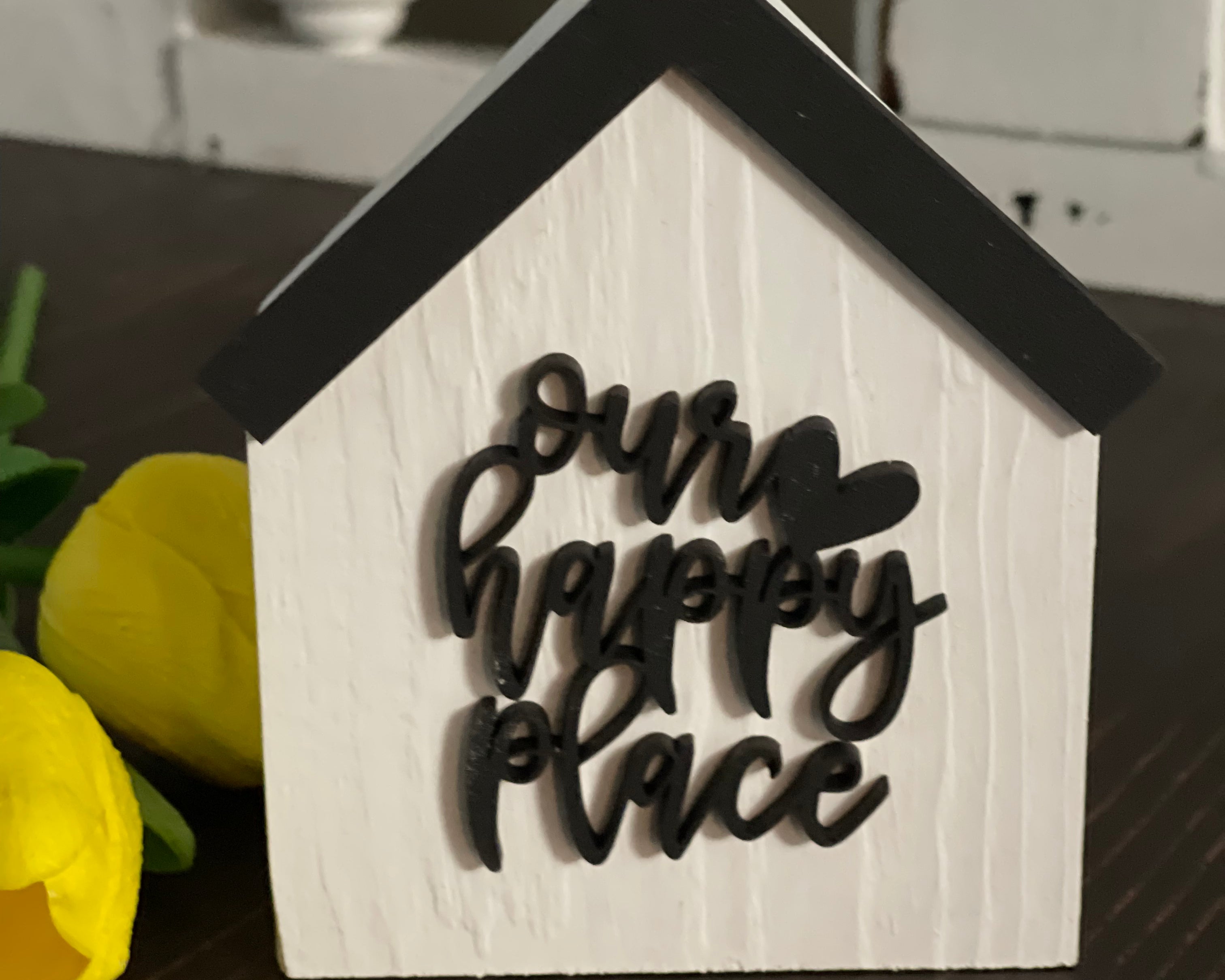 This image shows the white Our Happy Place.