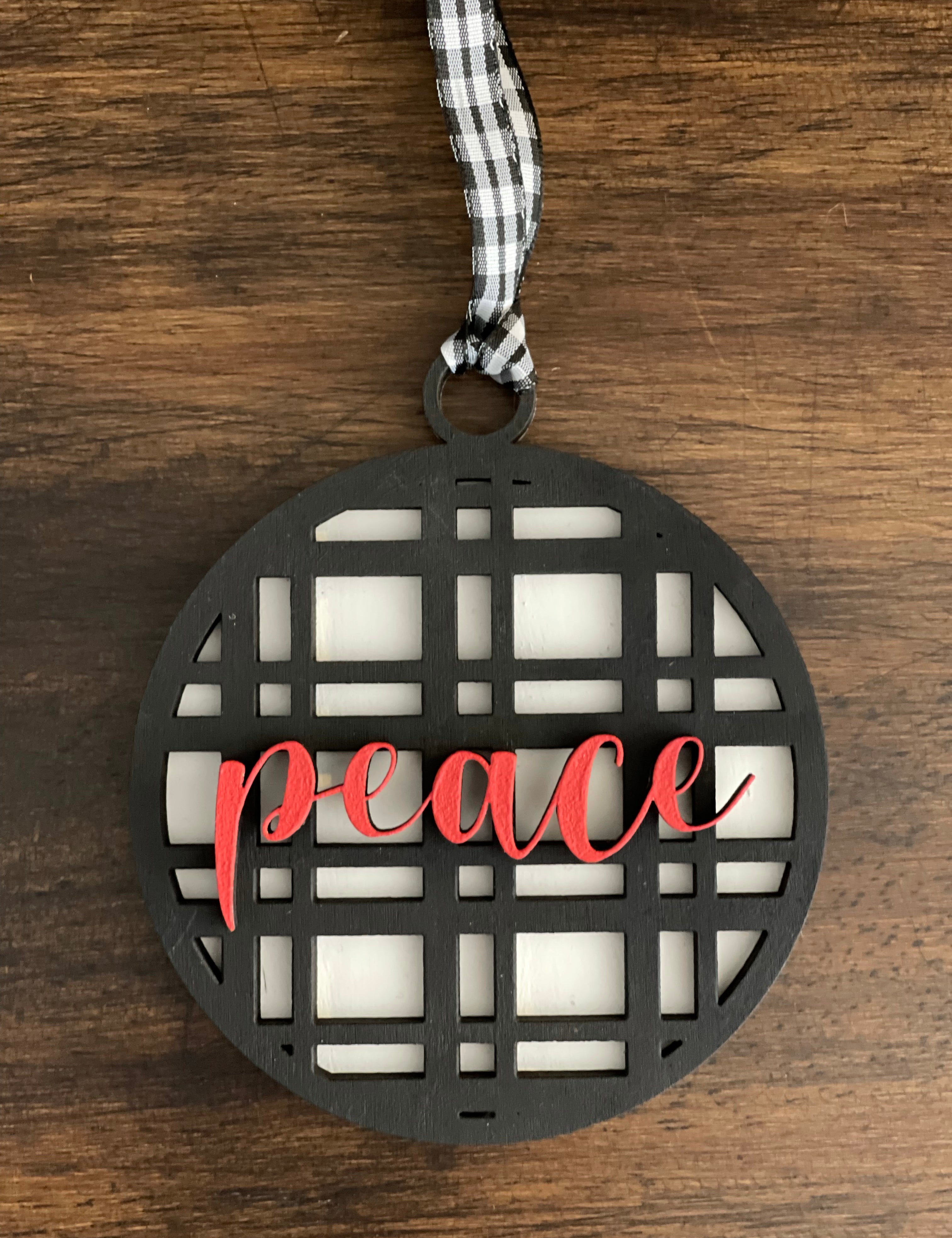 This is the black plaid peace ornament without a twine bow.