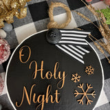 This image shows the large black O Holy Night.