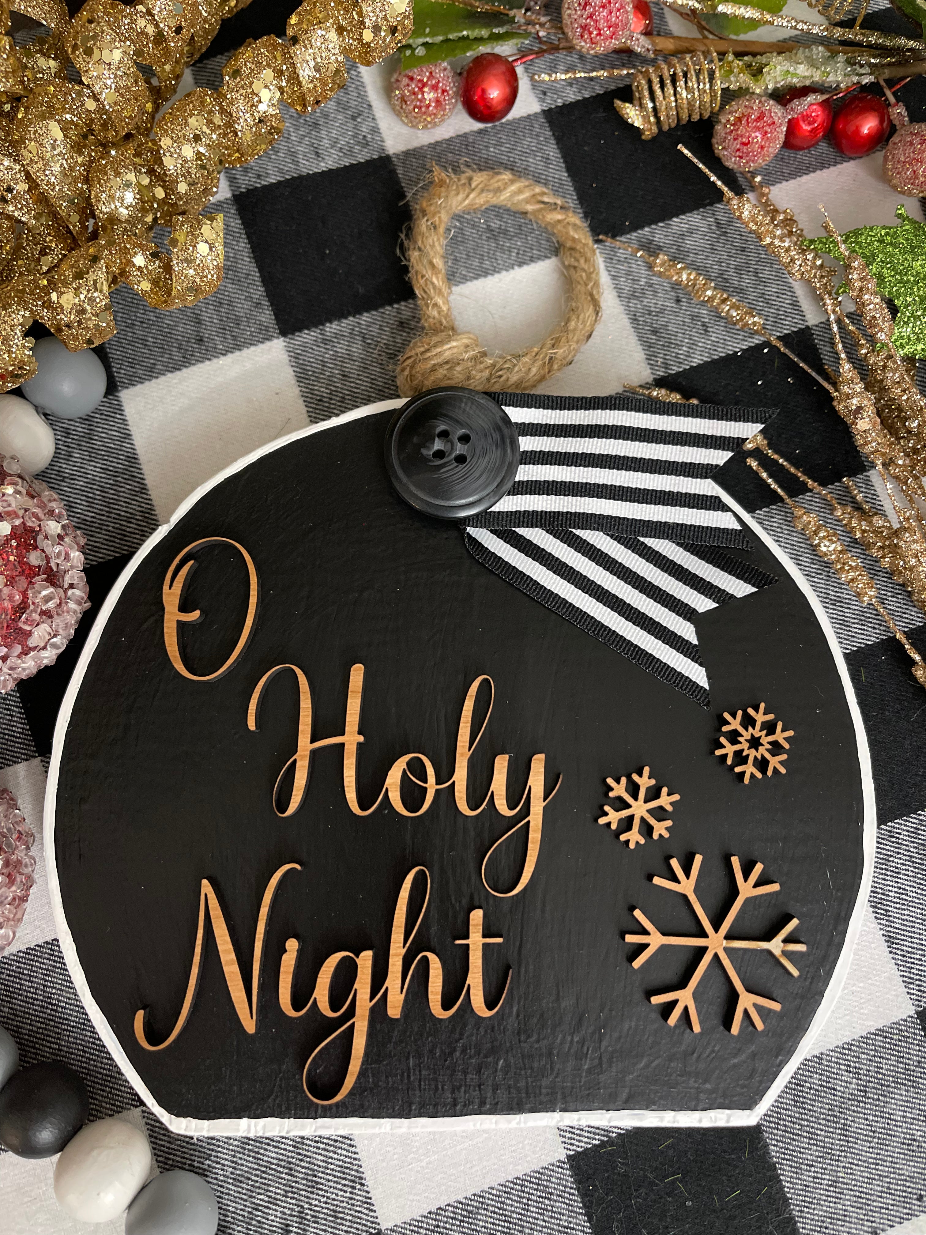 This image shows the large black O Holy Night.