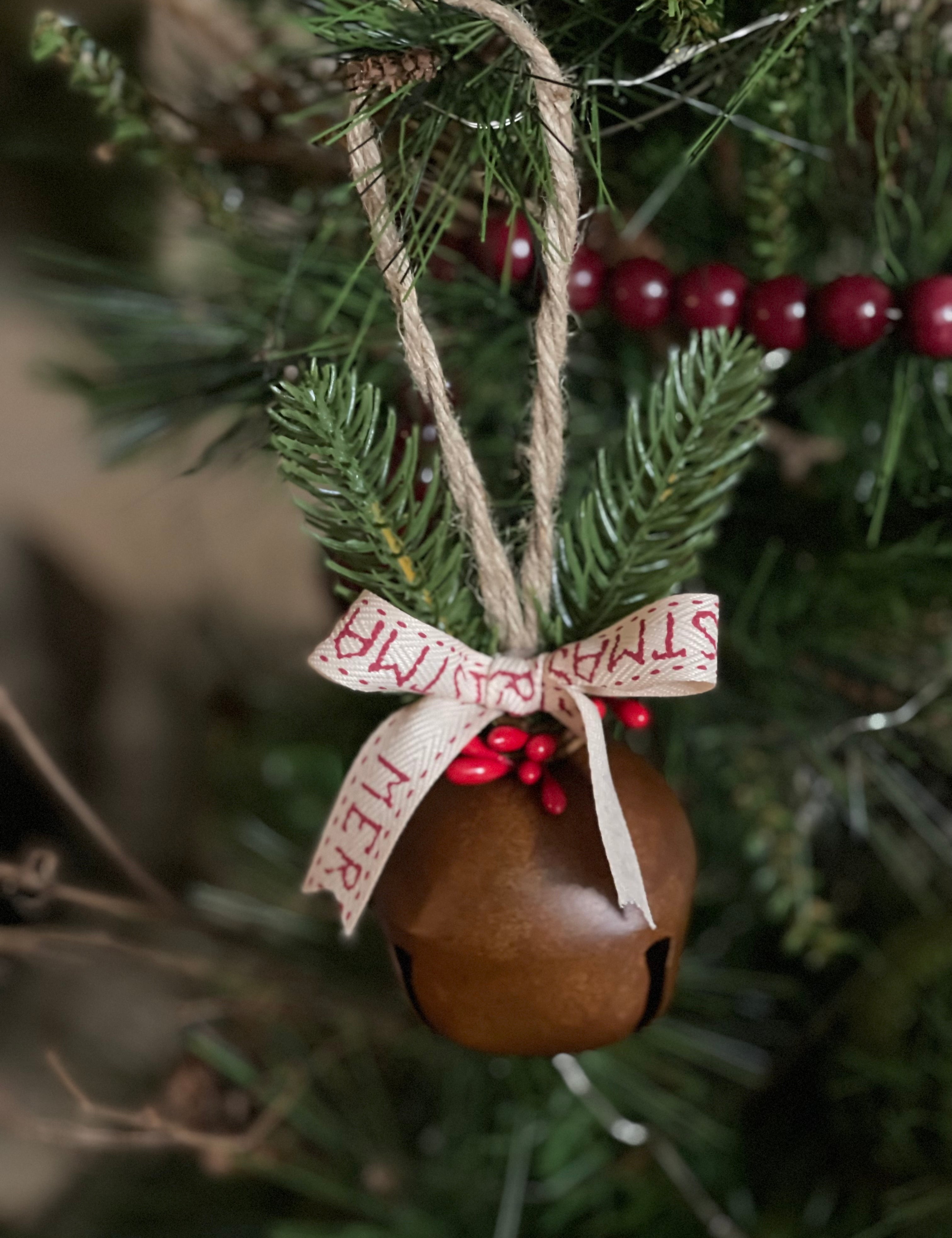 This beautiful rustic jingle bell can be hung as is or you can add a customized name or year.  If you'd like to add a customized saying, please make a note in the note section once added to your cart.
