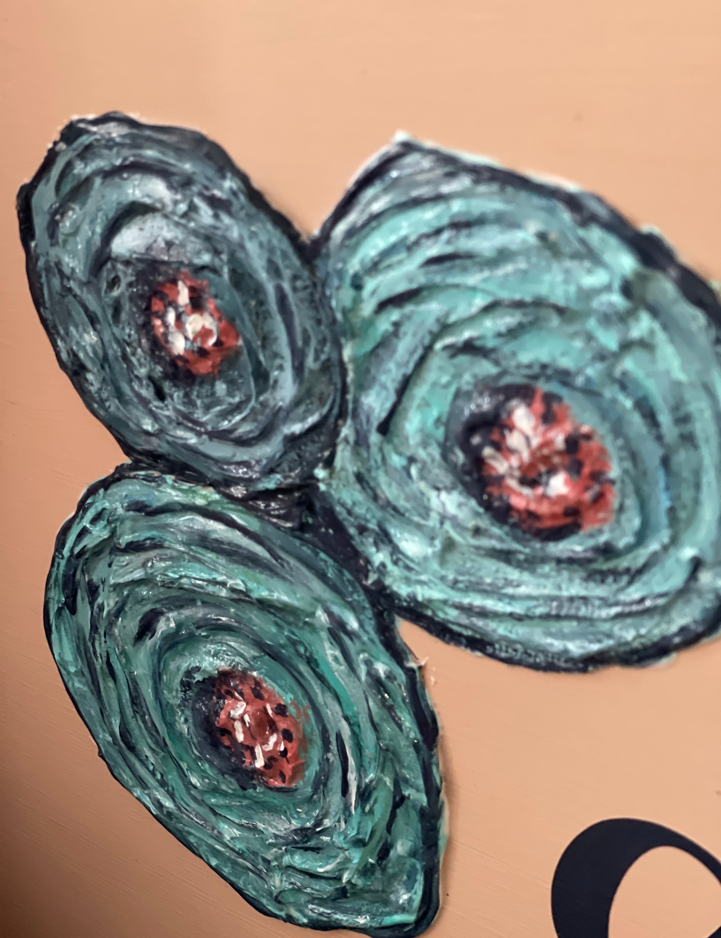 This image shows a close up of the textured floral roses.