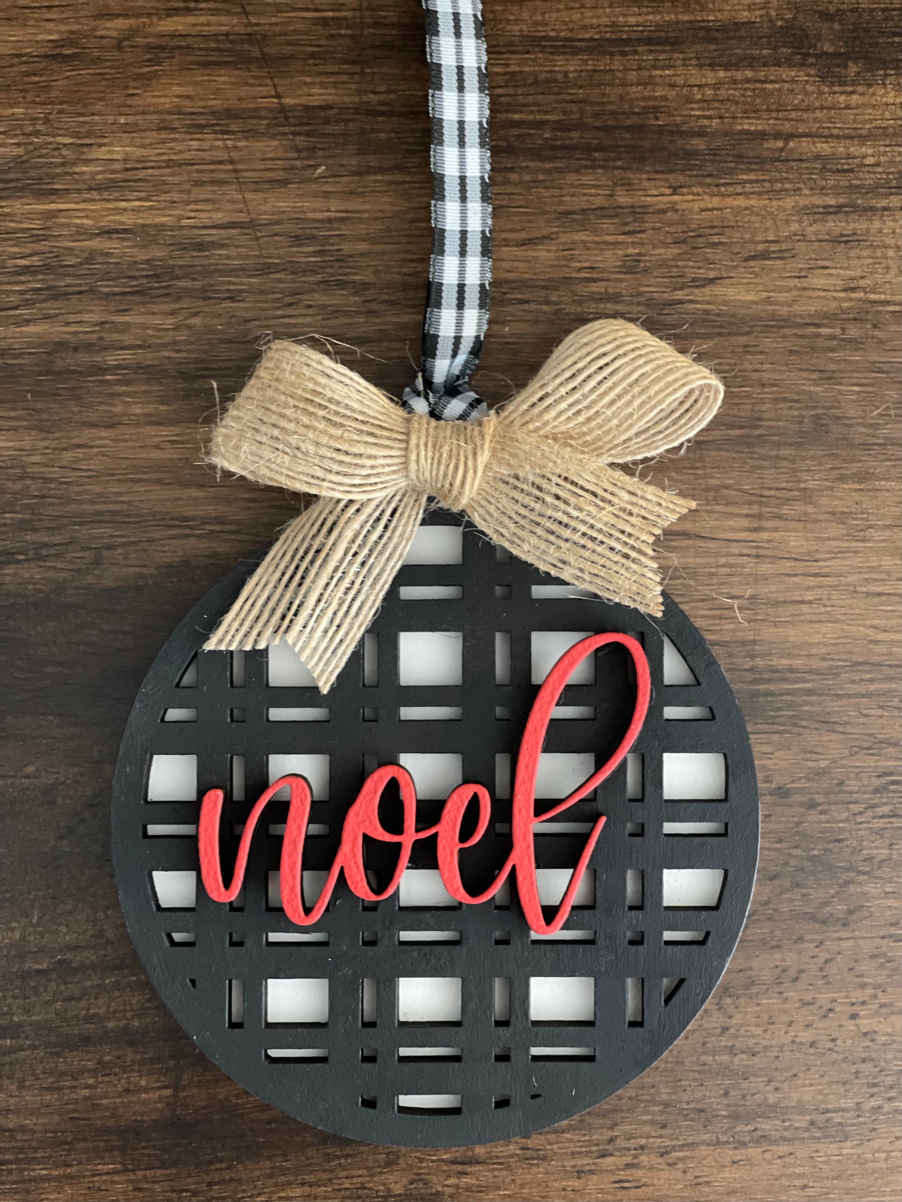 This is the black plaid noel ornament with a twine bow,