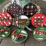 These beautiful 3D plaid wood ornaments each have 8 different sayings.  Merry Christmas, cheer, family, noel, peace, hope, joy and love.  They come black, red, green and mix.  
