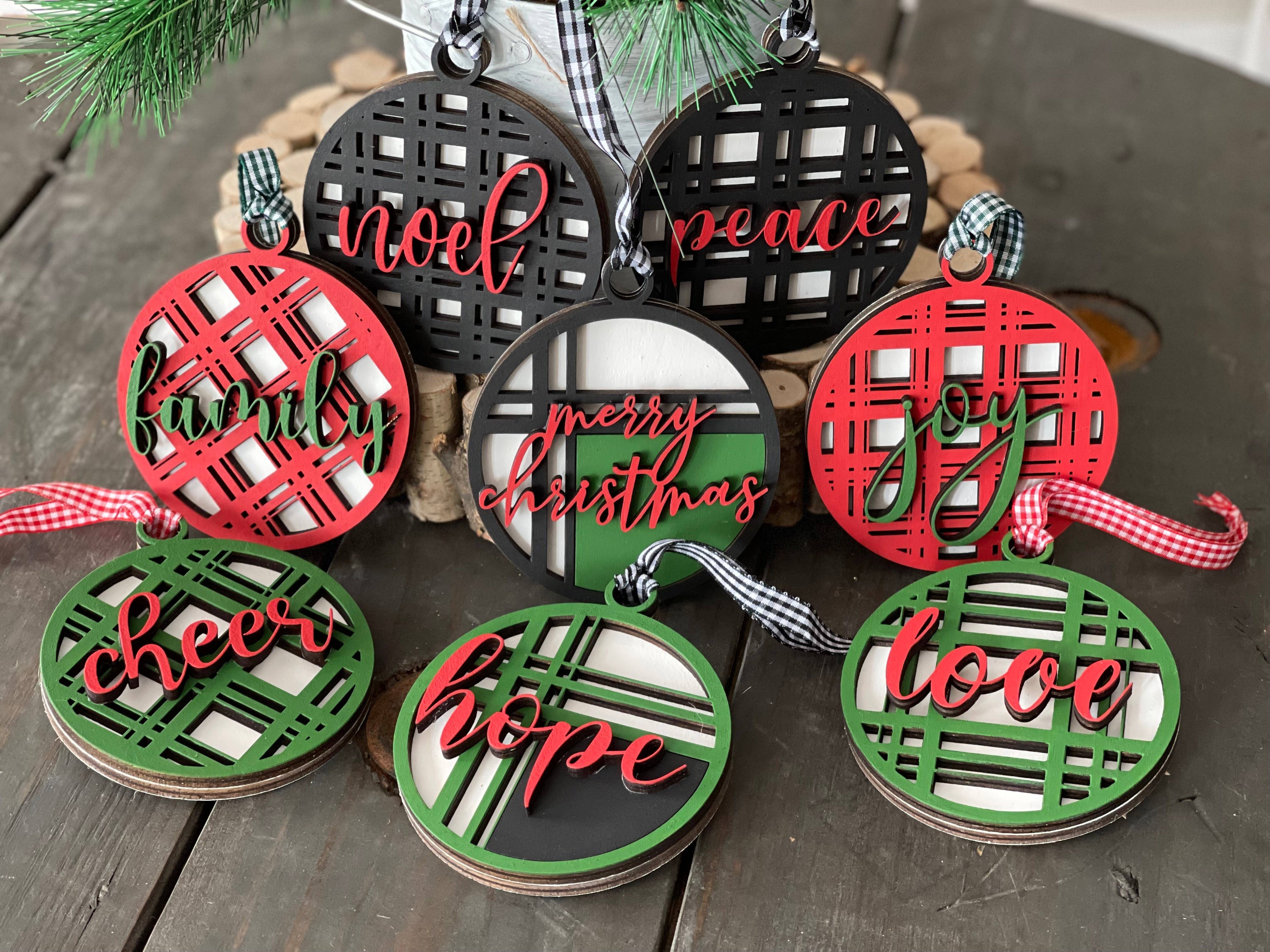 These beautiful 3D plaid wood ornaments each have 8 different sayings.  Merry Christmas, cheer, family, noel, peace, hope, joy and love.  They come black, red, green and mix.  