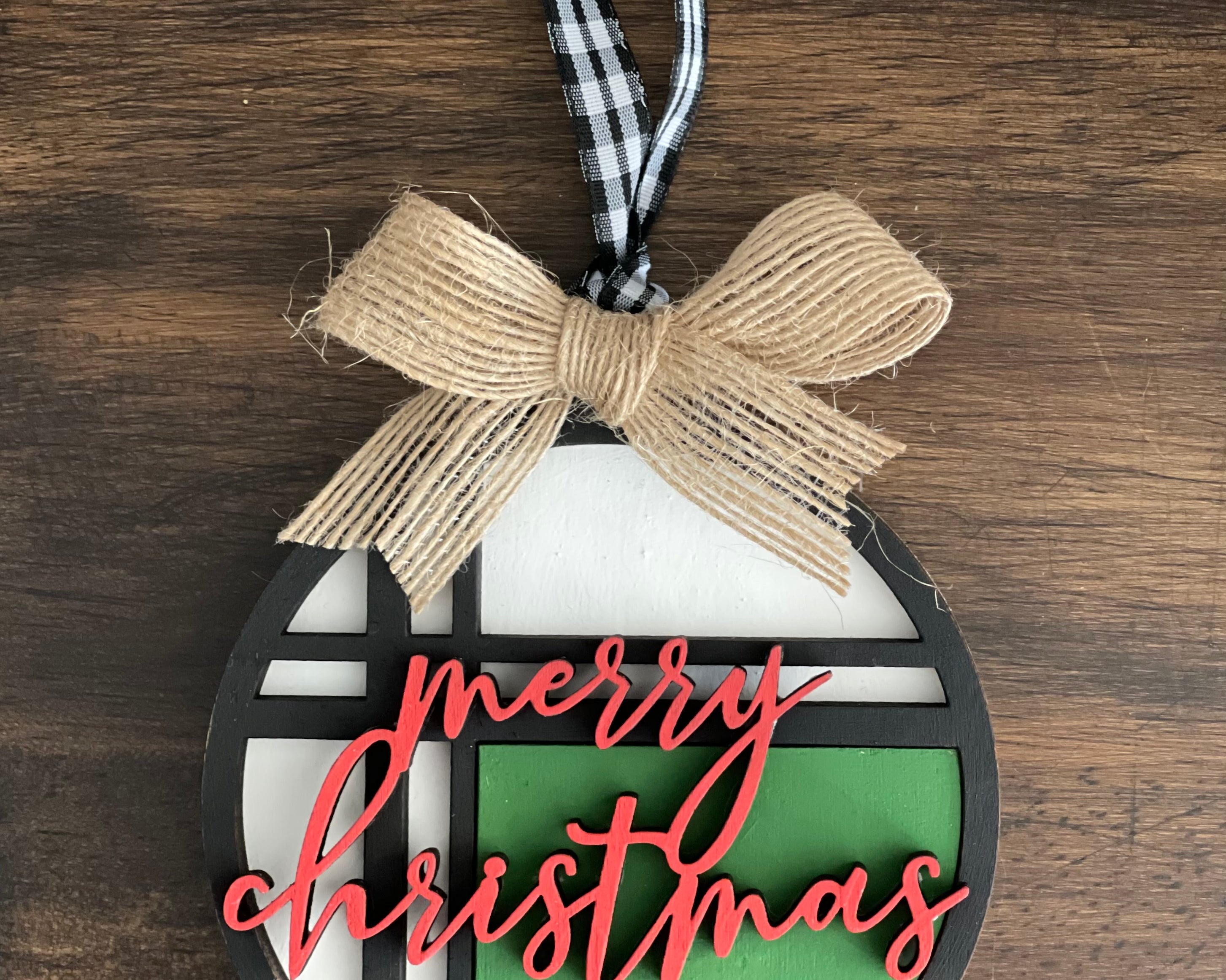 This is the red, green, white and black Merry Christmas ornament with a twine bow.