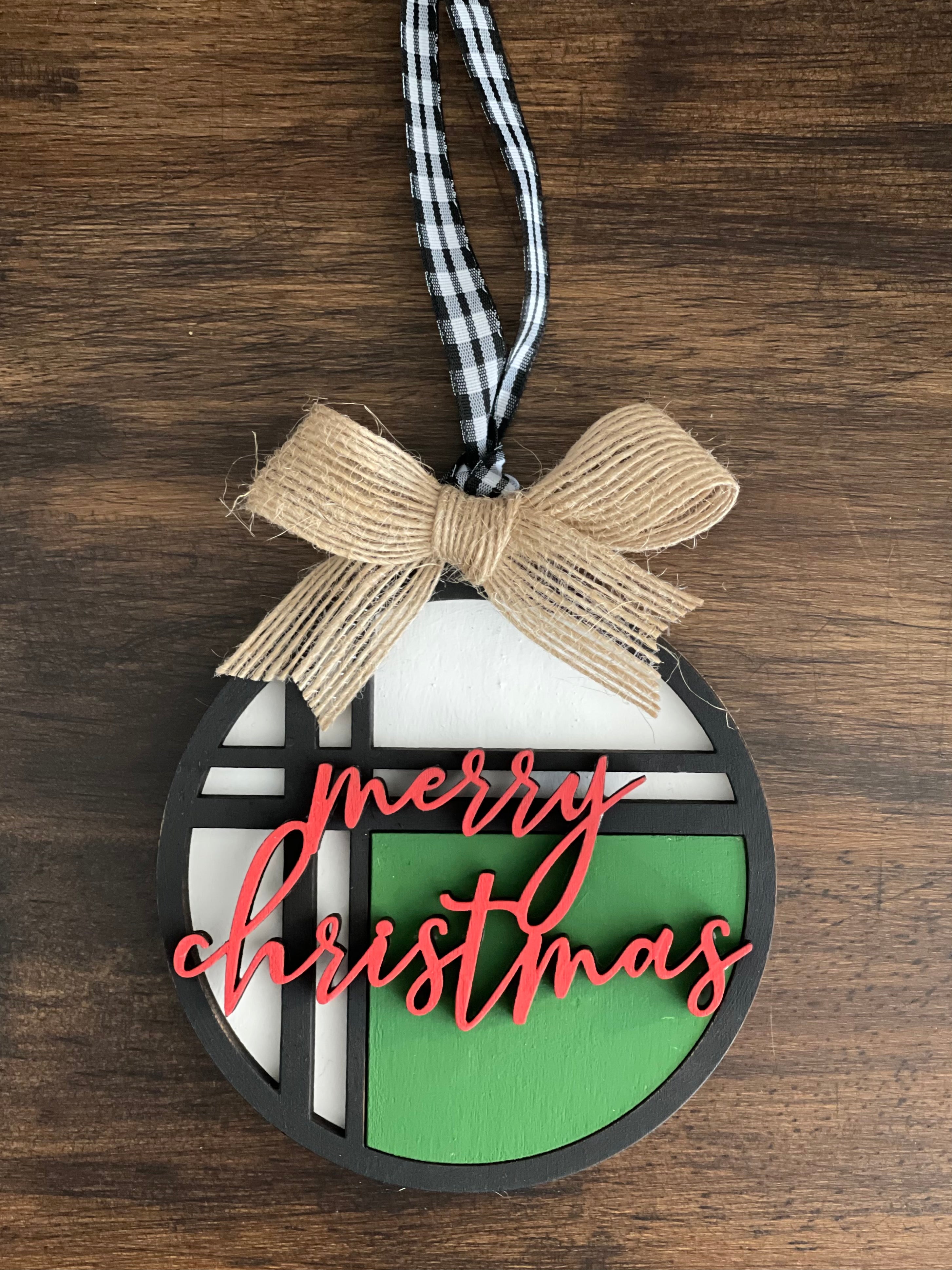 This is the red, green, white and black Merry Christmas ornament with a twine bow.