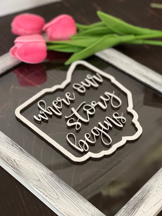 This image shows a close up of the 3D wood cutout design on the glass frame.