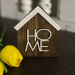 This image shows the stained HOME sign.