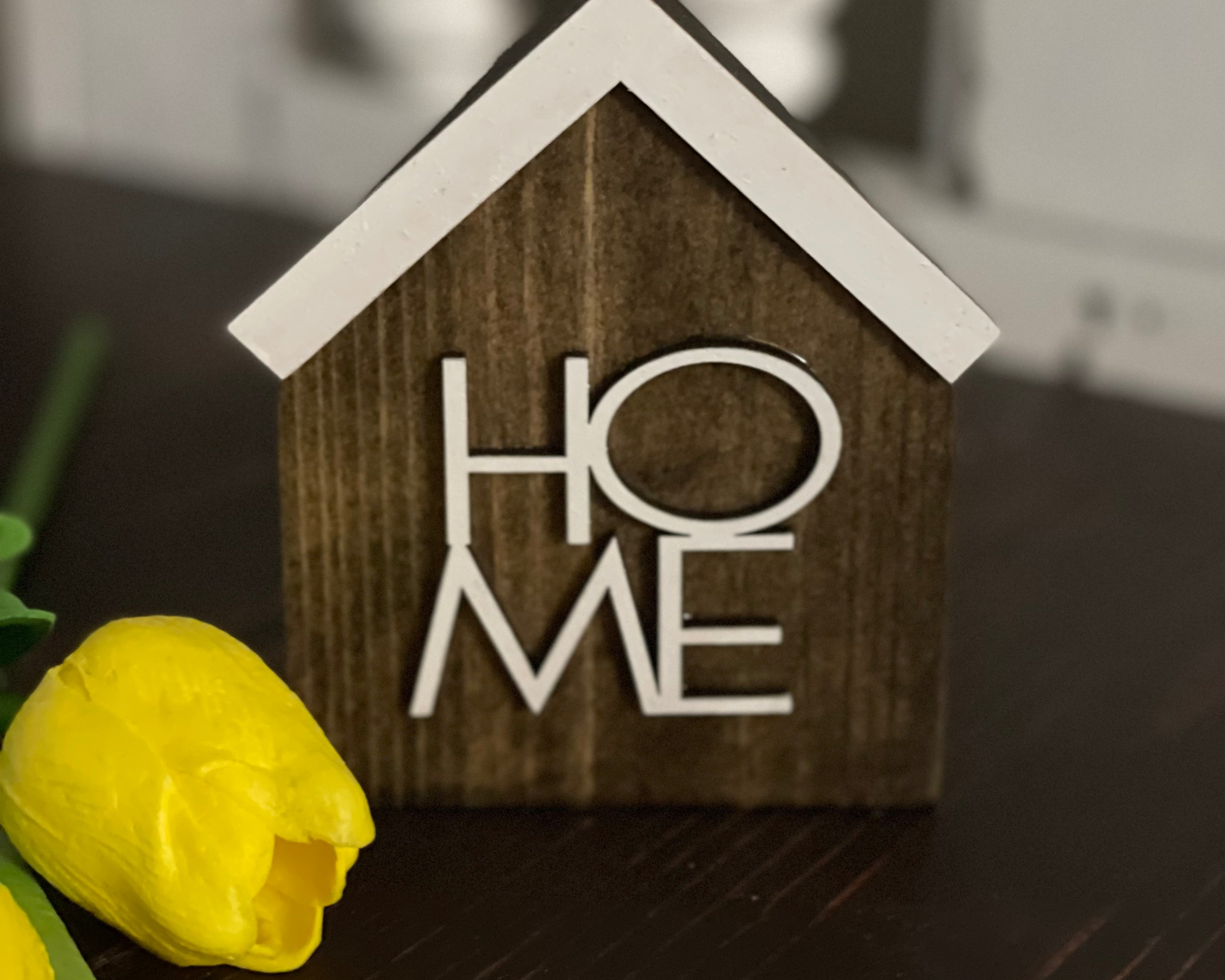 This image shows the stained HOME sign.