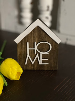 This image shows the stained HOME sign.