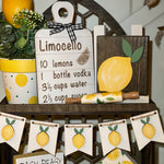 This image shows the white lemon banner hanging on our cathedral tiered tray.  It also has multiple lemon decor which is each sold separately.